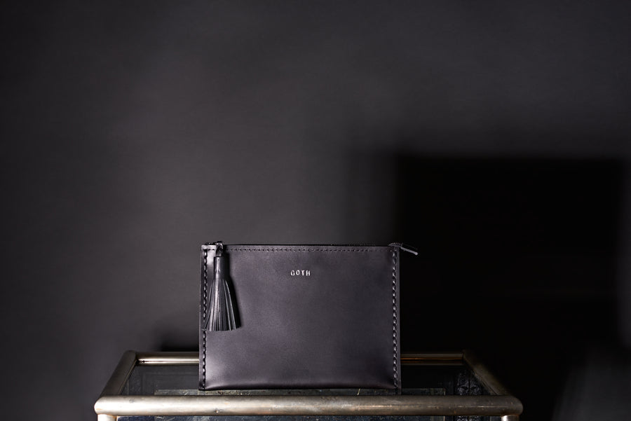 Embossed 'Goth' Laced Leather Clutch