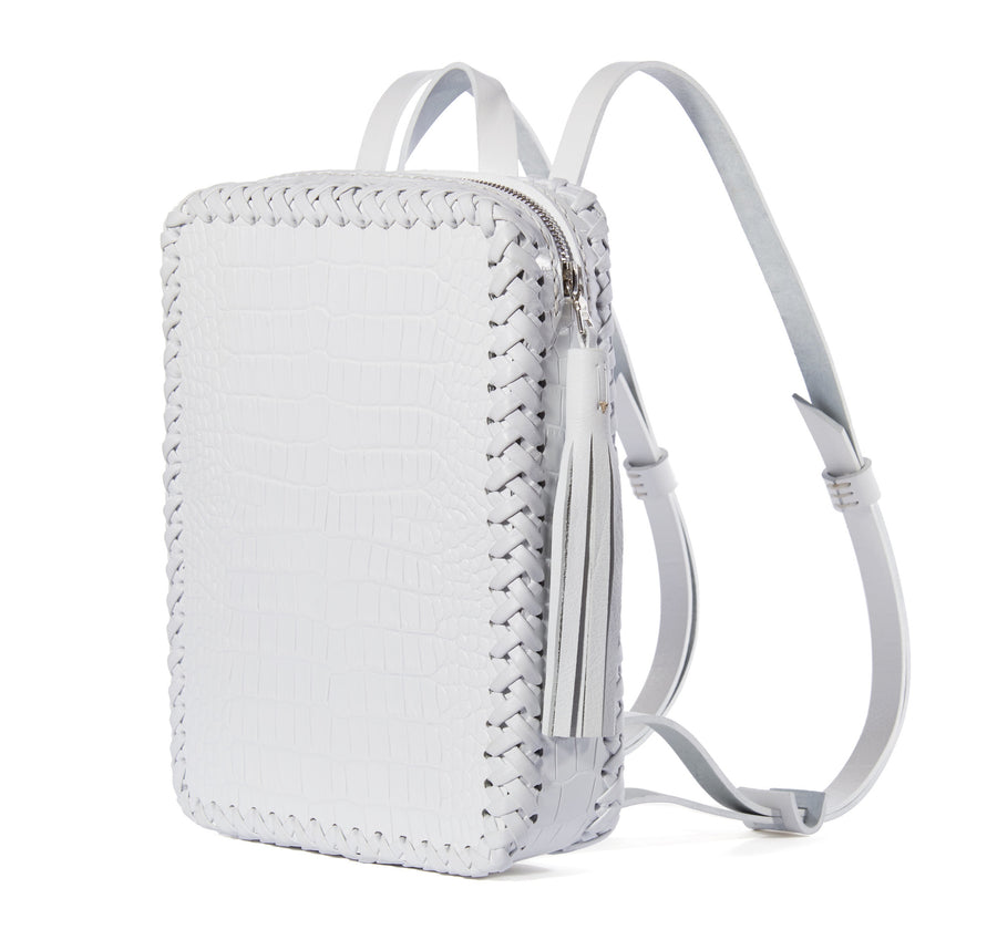 White Summer Shiny Reflective Embossed Croc Crocodile Alligator Cowhide Leather Mini Folio Backpack Wendy Nichol Handbag Purse Designer Handmade in NYC New York City Rectangle Square Braided Structured Structural French Work School Backpack Fringe Tassel Adjustable Straps Zip Zipper High Quality Leather Clueless 90s Cher