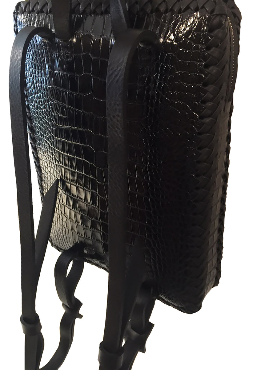 Black Shiny Reflective Embossed Croc Crocodile Alligator Cowhide Leather Folio Backpack Wendy Nichol Handbag Purse Designer Handmade in NYC New York City Rectangle Square Braided Structured Structural French Work School Backpack Fringe Tassel Adjustable Straps Zip Zipper High Quality Leather