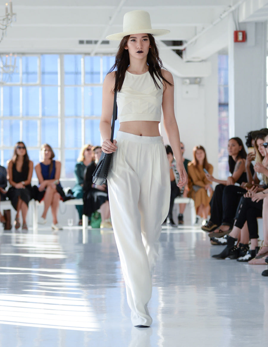 Mona IMG Model Wendy Nichol Clothing Designer Ready to Wear Fashion Runway show SS16 Guardians of Light High Noon Silk Mesh Cross Crop Top Sleeveless Cream White Silk Pleated Wide Leg Pants High Waisted Handmade in NYC  Custom Tailoring Made to Measure Order