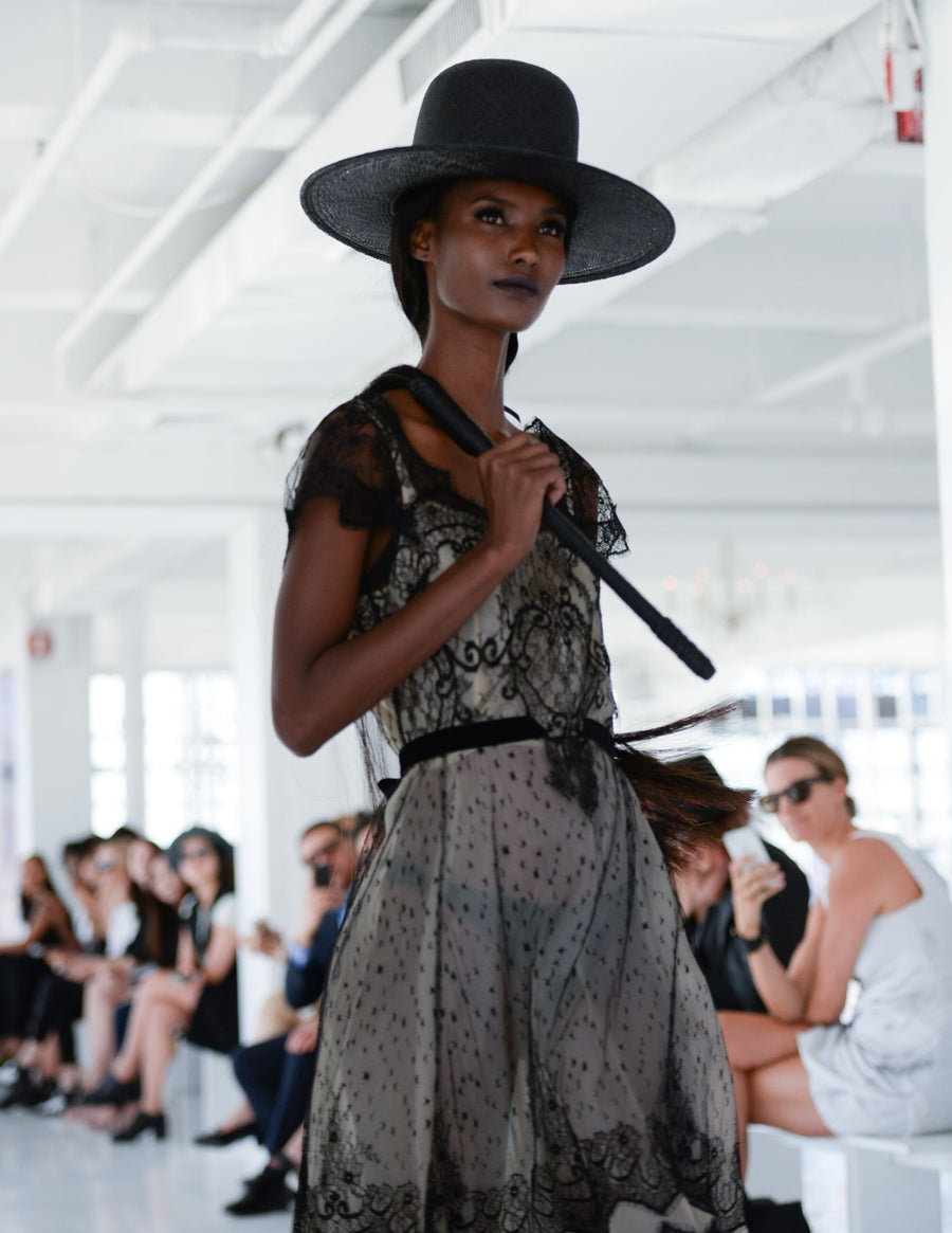 Fatima Siad IMG Model Wendy Nichol Clothing Designer Ready to Wear Fashion Runway Show SS16 Guardians of Light Afternoon Delight French Solstiss Silk Lace Nude Black Cut out should dress Sheer Handmade in NYC Made to Measure Order Custom Tailoring Fabric Color Black Wide Brim Straw Hat Brunette Horse Hair Whip
