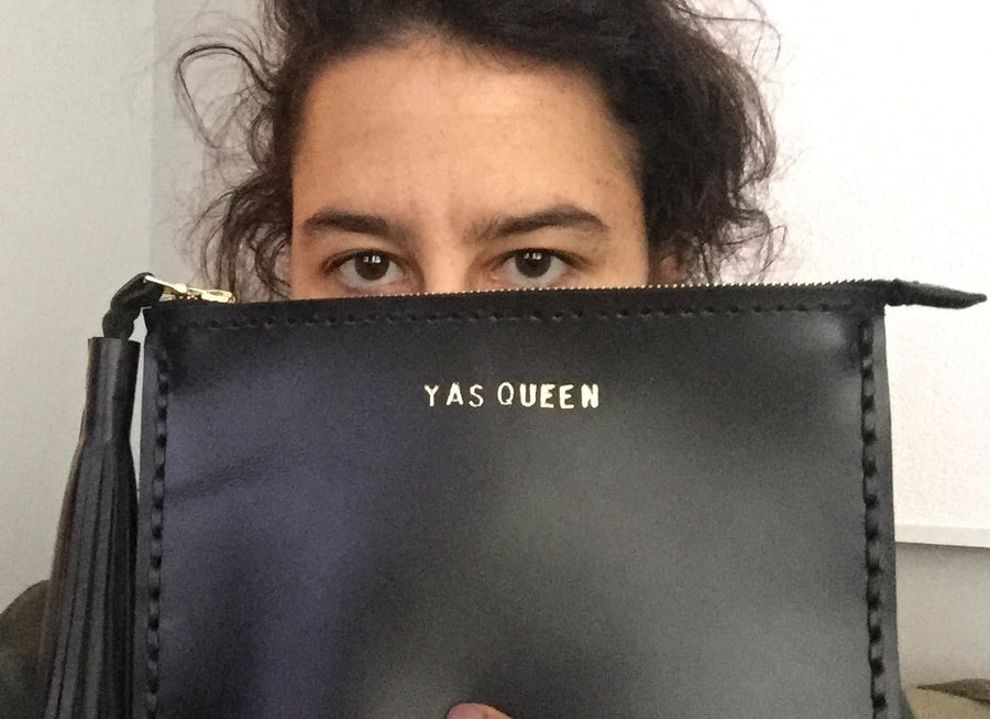 YAS QUEEN Ilana Glazer Broad City Vogue Vogue.com Wendy Nichol Fall's Most Cheeky Accessory is Beyonce and Broad City Approved Leather Large Laced Clutch Pouch Custom Embossed Initial Letter Monogram Card Phone Wallet Clutch Wendy Nichol Designer Purse handbags Handmade in NYC New York City Zip Zipper Pouch Smooth Black High Quality Leather Fringe Tassel Gold Silver Foil YAS QUEEN FUCK YES FUCK YEAH FUCK YOU FUCK NO FUCK OFF