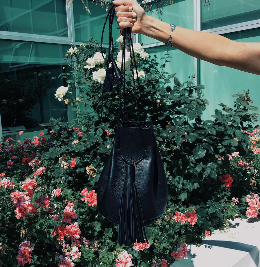Black Leather Whipstitch Bullet Bag Wendy Nichol Designer Purse Handbag Handmade in NYC New York City Leather Fringe Tassel Drawstring Bucket Pouch Boho Handbag
